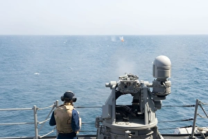 A MK-38 25mm machine gun is fired aboard USS William P. Lawrence A MK-38 25mm machine gun is fired aboard USS William P. Lawrence