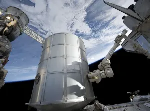 Space Photography Prints: The Leonardo Permanent Multipurpose Module in the grasp of Canadarm2