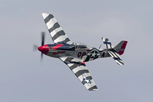 A P-51 Mustang flies by at Willow Run, Michigan A P-51 Mustang flies by at Willow Run, Michigan