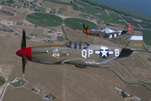 P-51C Mustang and P-51D Mustang flying over Boise, Idaho P-51C Mustang and P-51D Mustang flying over Boise, Idaho