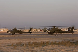 A pair AH-64D Apache Longbow Block III attack helicopters prepare for takeoff A pair AH-64D Apache Longbow Block III attack helicopters prepare for takeoff