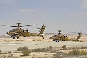 A pair of AH-64D Saraf attack helicopters of the Israeli Air Force A pair of AH-64D Saraf attack helicopters of the Israeli Air Force