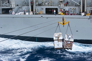 A pallet of supplies being delivered during a replenishment at sea A pallet of supplies being delivered during a replenishment at sea