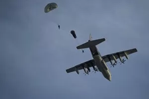 Airborne Forces Collection: Personnel jump from a C-130 Hercules during a static-line jump