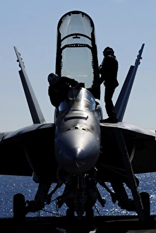 Pilots conducts a pre-flight inspection on an F/A-18F Super Hornet Pilots conducts a pre-flight inspection on an F/A-18F Super Hornet