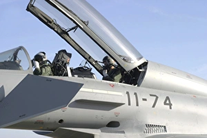 Pilots perform preflight checks in the cockpit of a Eurofighter Typhoon Pilots perform preflight checks in the cockpit of a Eurofighter Typhoon