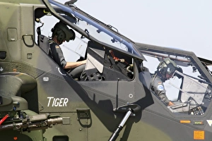 Pilots prepare for a mission in the Tiger Eurocopter of the Germany Army Pilots prepare for a mission in the Tiger Eurocopter of the Germany Army