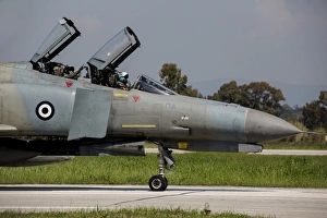 Pilots sitting in the cockpit of a Hellenic Air Force F-4E Phantom Pilots sitting in the cockpit of a Hellenic Air Force F-4E Phantom