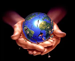 Planet Earth on human hands, breaking down and crumbling Planet Earth on human hands, breaking down and crumbling