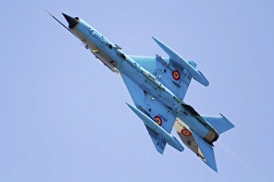 A Romanian Air Force MiG-21 Lancer over Romania A Romanian Air Force MiG-21 Lancer over Romania