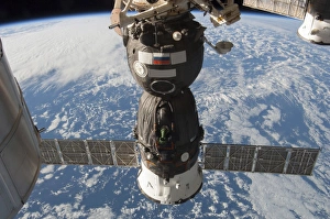 The Russian Soyuz TMA-11M spacecraft backdropped by Earth The Russian Soyuz TMA-11M spacecraft backdropped by Earth