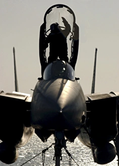 A Sailor cleans the canopy of a F-14B Tomcat A Sailor cleans the canopy of a F-14B Tomcat