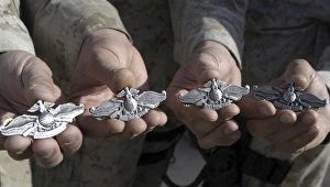 Sailors display their Fleet Marine Force Warfare Device Sailors display their Fleet Marine Force Warfare Device