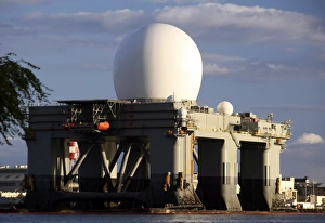 Sea Based X-band Radar dome modeled by the setting sun at Pearl Harbor naval shipyard Sea Based X-band Radar dome modeled by the setting sun at Pearl Harbor naval shipyard