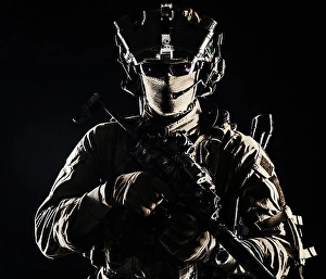 Black Background Portraits Prints: Serviceman equipped with modern weapons