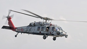 A SH-60 helicopter in flight over the Persian Gulf A SH-60 helicopter in flight over the Persian Gulf