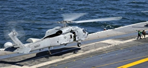 An SH-60F Sea Hawk helicopter lands aboard the aircraft carrier USS Harry S. Truman An SH-60F Sea Hawk helicopter lands aboard the aircraft carrier USS Harry S. Truman