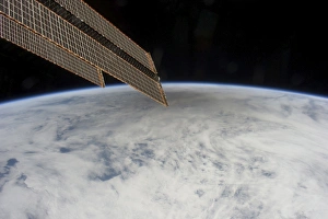 A shadow of the moon from a solar eclipse spreads across cloud cover on Earth A shadow of the moon from a solar eclipse spreads across cloud cover on Earth