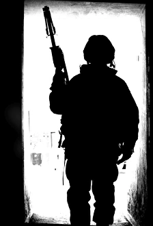 Silhouette of a British soldier in a doorway at Camp Condor, Iraq Silhouette of a British soldier in a doorway at Camp Condor, Iraq