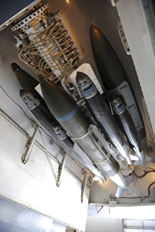 Military Aviation Equipment Prints: Smart munitions on an ejector rack of a B-1B Lancer