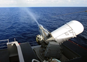 Smoke rolls down the barrels of the forward-starboard-mounted MK 15 Phalanx Close-In Smoke rolls down the barrels of the forward-starboard-mounted MK 15 Phalanx Close-In