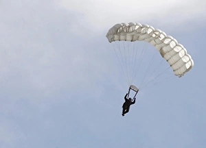 A soldier floats to the ground during High Altitude Low Opening training A soldier floats to the ground during High Altitude Low Opening training