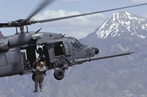 A soldier is lifted on board an Air Force HH-60 Pave Hawk A soldier is lifted on board an Air Force HH-60 Pave Hawk