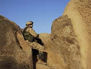 A soldier takes up a position during a security halt A soldier takes up a position during a security halt