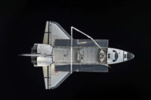 Space shuttle Atlantis backdropped against the blackness of space Space shuttle Atlantis backdropped against the blackness of space
