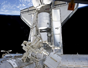 Space shuttle Discovery and the Canadian-built Dextre docked to the International Space shuttle Discovery and the Canadian-built Dextre docked to the International