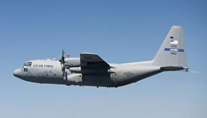 A specially modified C-130 Hercules in flight A specially modified C-130 Hercules in flight