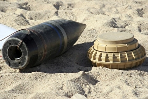 A static display of a converted ordnance shell and a simple mine A static display of a converted ordnance shell and a simple mine
