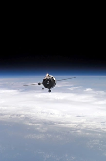 A supply vehicle backdropped by the blackness of space and Earths horizon A supply vehicle backdropped by the blackness of space and Earths horizon