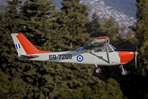 A T-41D trainer aircraft of the Hellenic Air Force flying over Tatoi, Greece A T-41D trainer aircraft of the Hellenic Air Force flying over Tatoi, Greece