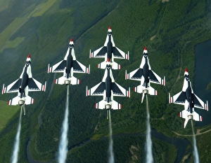 The Thunderbird aerial demonstration team performs a loop while in the Delta formation The Thunderbird aerial demonstration team performs a loop while in the Delta formation