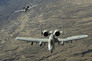 A two-ship A-10 Thunderbolt II formation flies a combat mission over Afghanistan A two-ship A-10 Thunderbolt II formation flies a combat mission over Afghanistan
