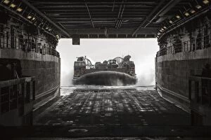Air Cushioned Landing Craft Collection: U. S. Navy landing craft air cushion enters the well deck of the USS Green Bay