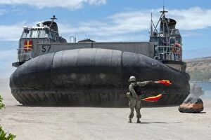 Air Cushioned Landing Craft Collection: U. S. Navy Seaman directs a landing craft air cushion