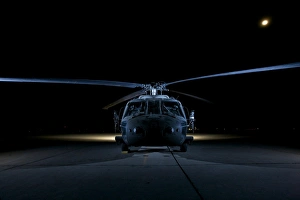 A UH-60 Black Hawk helicopter lit up by multiple external flash units A UH-60 Black Hawk helicopter lit up by multiple external flash units
