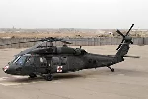 Images Dated 25th December 2005: A UH-60 Blackhawk Medivac helicopter sits on the flight deck at Camp Warhorse
