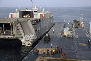 Vehicles are transferred aboard the high speed vessel Swift Vehicles are transferred aboard the high speed vessel Swift