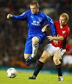 Images Dated 7th October 2002: Clash at Old Trafford: Scholes vs Rooney - Manchester United's Iconic Rivalry