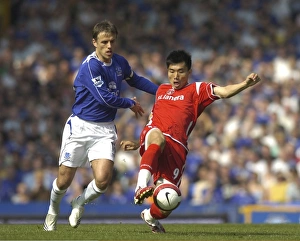 Everton v Charlton Athletic Phil Neville and Zheng Zhi Everton v Charlton Athletic Phil Neville and Zheng Zhi