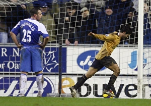 Evertons Arteta celebrates after scoring as Wigan Athletics Unsworth looks on during their English Evertons Arteta celebrates after scoring as Wigan Athletics Unsworth looks on during their English