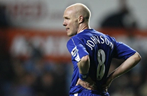 Evertons Johnson holds his side after their English Premier League soccer match against Evertons Johnson holds his side after their English Premier League soccer match against
