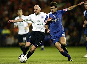 Evertons Lee Carsley and Peterbroughs Richard Butcher in action Evertons Lee Carsley and Peterbroughs Richard Butcher in action