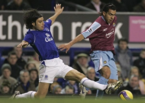 Evertons Valente challenges West Ham Uniteds Tevez for the ball during their English Premier Leagu Evertons Valente challenges West Ham Uniteds Tevez for the ball during their English Premier Leagu