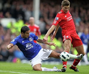 Images Dated 17th October 2010: Intense Rivalry: Tim Cahill vs Steven Gerrard Battle for the Ball at Goodison Park