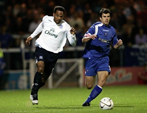 Peterborough United v Everton - Joleon Lescott and Peterboroughs Richard Butcher Peterborough United v Everton - Joleon Lescott and Peterboroughs Richard Butcher