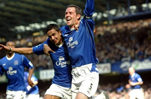 Tim Cahill congratulates David Weir on his opening goal Tim Cahill congratulates David Weir on his opening goal